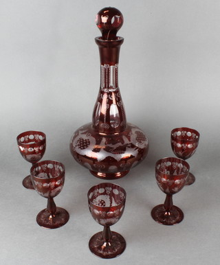A Continental ruby flash glass mallet shaped decanter and stopper and 5 glasses decorated with buildings in landscapes 