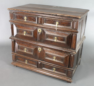 A 17th Century oak chest with geometric mouldings, fitted 4 long drawers with brass pear drop handles and escutcheons, 25"h x 38"w x 23 1/2"d 