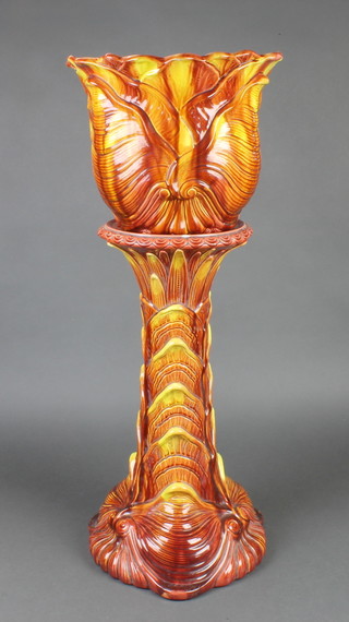 A Victorian ochre jardiniere and stand with shell decoration 32"