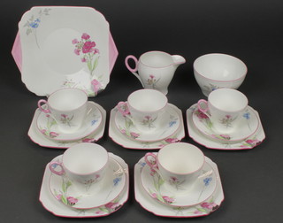 A Shelley Art Deco tea set with floral sprays comprising 5 tea cups, 5 saucers, a cream jug, sugar bowl, a sandwich plate and 5 small plates