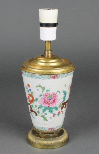 A 19th Century famille rose tapered vase decorated with flowers, now converted to electricity with gilt mounts 11"