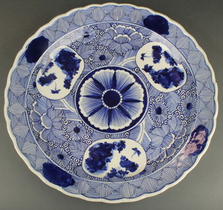 An early 20th Century Japanese charger decorated with stylised flowers 16"