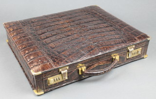 A brown crocodile briefcase with gilt mounts