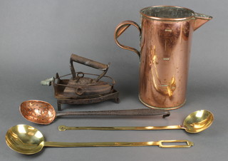 A copper jug 10",  a straining spoon with iron handle, a flat iron and stand etc