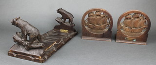 Of World War One interest, a pair of carved and pierced teak bookends formed from teak off HMS Iron Duke, Admiral Jericho's flagship Jutland 1915 together with a pair of carved Swiss wooden expanding bookends 