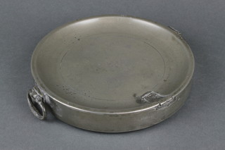 A circular pewter twin handled plate warmer, the base with London touch mark 8" 