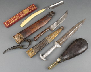 An Eastern dagger with 5 1/2" blade and leather scabbard, an edge dagger with 7 1/2" blade, a Jordan cutthroat razor and a leather and brass shot flask (f)