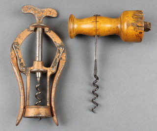 A 19th Century James Healey & Sons A1 double action corkscrew and a 19th Century corkscrew with turned wooden handle (some damage to the side) 