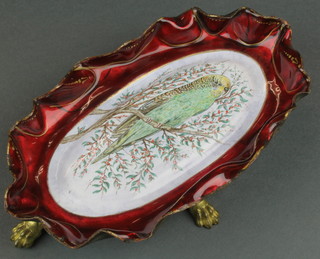 A 19th Century oval French enamelled copper pin tray decorated a yellow budgerigar and raised on 4 hoof feet 