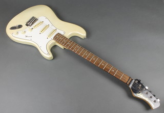 A Hondo 1980's/1990's white plastic electric guitar