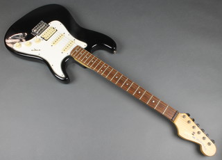 An Indian Sunn Mustang black and white electric guitar 