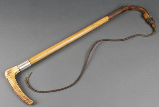 A hunting crop with silvered band and stag horn handle 