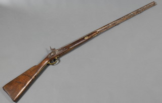 A 19th Century muzzle loading percussion fowling piece with 37 1/2" barrel and ram rod, the lock marked 1893 India BMC, there is a crack to the stock 