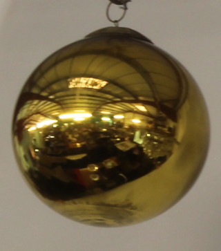 A Victorian gold glass witches ball