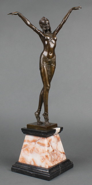 An Art Deco style bronze figure of a standing lady with arms outstretched, raised on a tapered 2 colour marble base 22"h 