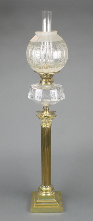 A Victorian brass and glass oil lamp raised on a stepped brass base with reeded column, Corinthian capital and cut glass reservoir 26 1/2"h 