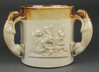 An unusual 19th Century stoneware cup, the moulded decoration with dressed monkeys playing cards, drinking and smoking, the 3 handles in the form of hounds 6"