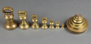 7 various brass bell weights, 4 Victorian brass weights - 2lbs, 1lbs, 8oz and 1oz - the 1oz with City of London crest and 4 circular brass graduated weights 2oz, 1oz, 1/2oz, 1/4oz 