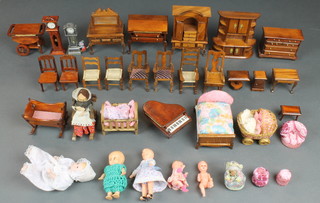 A collection of various dolls house furniture 