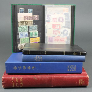 An album of various Hong Kong stamps 1862-1975, a New Age album of Australian stamps 1892-1873, 2 school boy albums of world stamps, a stockbook of used Australian stamps - Victoria - Elizabeth II and a green stockbook of American used stamps