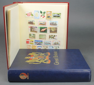 A stock book containing World stamps, an album of mint Commonwealth stamps including Mauritius, Namibia, Nauru,  