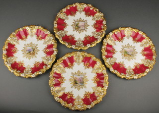 Four Edwardian Coalport dessert plates the red and gilt borders enclosing country panels 9 1/2"