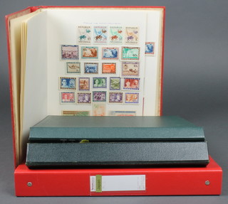A small album of mint Republic of Indonesia stamps, an album of Fujeira stamps and various West German stamps, a loose ring album of Japan 