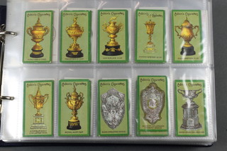 Cigarette cards, Adkins Sons Ltd - Cups and Trophies 1914 a set of 30, Adkins of Liverpool Club Badges 1914 a set of 50, Jeffrey Phillips London Sports 1943 white card set of 25,  Sports Series Old Sporting Prints 1924 set of 25,  Who's Who in Sports 1926 set of 50, Adkins ABC of Sport 1927 set of 25, W A & A C Churchman Sporting Trophies a smaller size April 1927 set of 25, Churchman's  Lawn Tennis a small size 1928 set of 50, Jeffrey Phillips Olympic Champions 1928 a set of 36, Sporting Champions 1929 a set of 36, Major Drapkin & Co Sporting Celebrities in Action 1930 export a set of 36,  Falconer London Old Sporting Prints 1930 a set of 25, John Players & Sons Country Sports 1930 a set of 25, Jeffrey Phillips Speed Champions 1930 a set of 30, W D & H O Wills Speed 1930 a set of 50