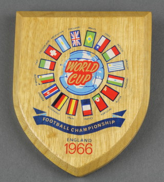 A 1966 World Football Champions shaped oak shield with transfer decoration 4 1/2" 