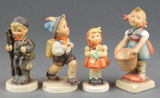 A Hummel figure Chimney sweep 12 2/0 4", school boy 82 2/0 4",  girl with doll 239/B 3 1/2" and girl with basket 7 4"