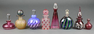 A cranberry squat scent with clear stopper 3 1/2" signed together with 7 other assorted scent bottles