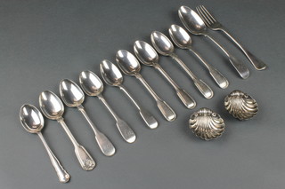 A pair of Victorian silver shell salts Birmingham 1897, nine silver spoons and a fork 285g
