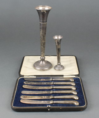 A silver tapered spill vase 8", a ditto 4 1/2" and a cased set of knives 