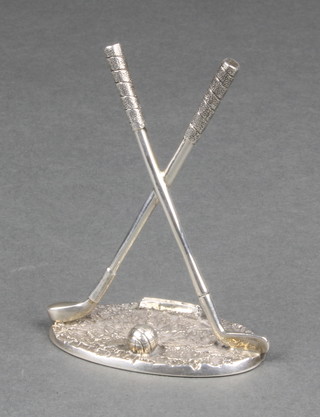 An Edwardian silver novelty menu holder in the form of 2 crossed golf clubs and a ball, Sheffield 1903