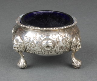 A Victorian silver repousse salt on claw and ball feet, London 1843 114g