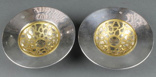 A pair of silver deep bowls with gilt interiors 