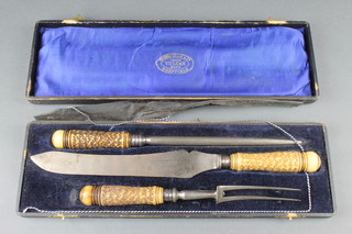 A cased 3 piece horn handled carving set