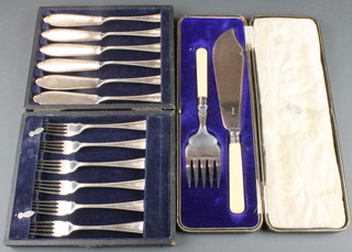 A pair of plated cased fish servers and 6 pairs of ditto eaters