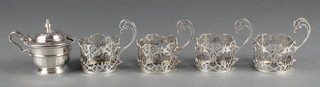A silver mustard Birmingham 1934 and four silver cup holders 144g