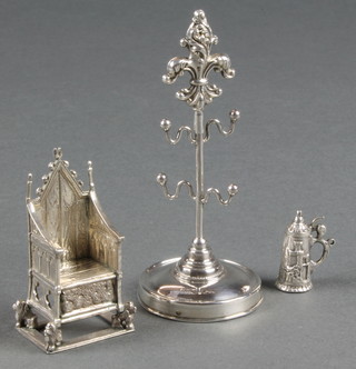 An Edwardian silver Throne of Scone London 1901 a tankard charm and ring tree