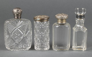 A Vicrorian cut glass flattened scent with silver top Chester 1899 and three others