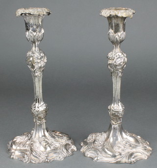 A pair of 19th Century silver plated Rococo candlesticks 10 1/2"