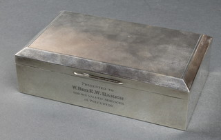 A silver engine turned cigarette box 7" x 4"  with presentation inscription together with a silver envelope stamp case