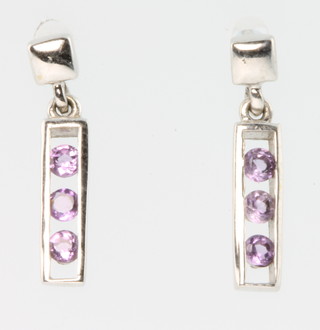 A pair of white gold pink sapphire drop earrings and a pair of 9ct sapphire and diamond ditto