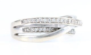An 18ct white gold  diamond crossover ring, Size M