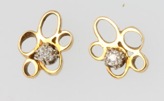 A pair of yellow gold single stone diamond open ear studs