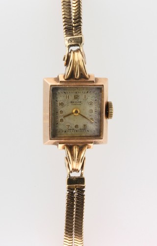 A lady's Benson 9ct yellow gold wrist watch on a ditto strap 22g