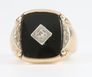 A gentleman's 9ct yellow gold onyx and diamond signet ring, gross 9.3 grams, size S
