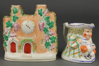 A Victorian Staffordshire toby jug 5" a clock tower spill vase 7"