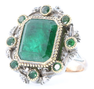 A yellow gold emerald and diamond dress ring, size O